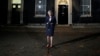 FILE - Britain's Prime Minister Theresa May delivers remarks on the draft Brexit deal outside 10 Downing Street in London, Nov. 14, 2018.