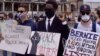 FILE - Protesters demonstrate near the U.S. Embassy in Paris. (Lisa Bryant/VOA)