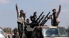 Libyan National Army (LNA) members, commanded by Khalifa Haftar, head out of Benghazi to reinforce the troops advancing to Tripoli, in Benghazi, Libya, Apr. 7, 2019. 