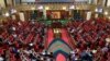 FILE - Kenyan members of parliament maintain social distance amid the COVID-19 pandemic inside the Parliament buildings in Nairobi, June 10, 2021. 