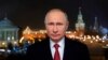 In this photo released by Kremlin Press service via Sputnik agency, Russian President Vladimir Putin speaks during a recording of his annual televised New Year's message in the Kremlin in Moscow, Jan. 31, 2018.