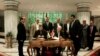 Senior Fatah official Azzam al-Ahmad, center right, and Hamas' representative, Saleh al-Arouri, center left, sign a reconciliation deal during a short ceremony at the Egyptian intelligence complex in Cairo, Egypt, Thursday, Oct. 12, 2017. 
