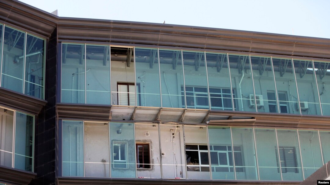 A rocket-propelled grenade damaged Libyan government offices in Tripoli June 4, 2014.