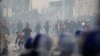 Anti-riot police officers clash with people protesting against President Abdelaziz Bouteflika, in Algiers, Algeria, March 8, 2019. 