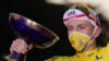 Tour de France winner Slovenia's Tadej Pogacar, wearing the overall leader's yellow jersey, celebrates on the podium after the twenty-first and last stage of the Tour de France cycling race over 122 km, from Mantes-la-Jolie to Paris, Sept. 20, 2020.