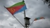  Ethiopian and Eritrean flags flutter during the welcoming ceremony of Eritrean Foreign Minister Osman Saleh and his delegation at the Bole International Airport in Addis Ababa, Ethiopia, June 26, 2018.