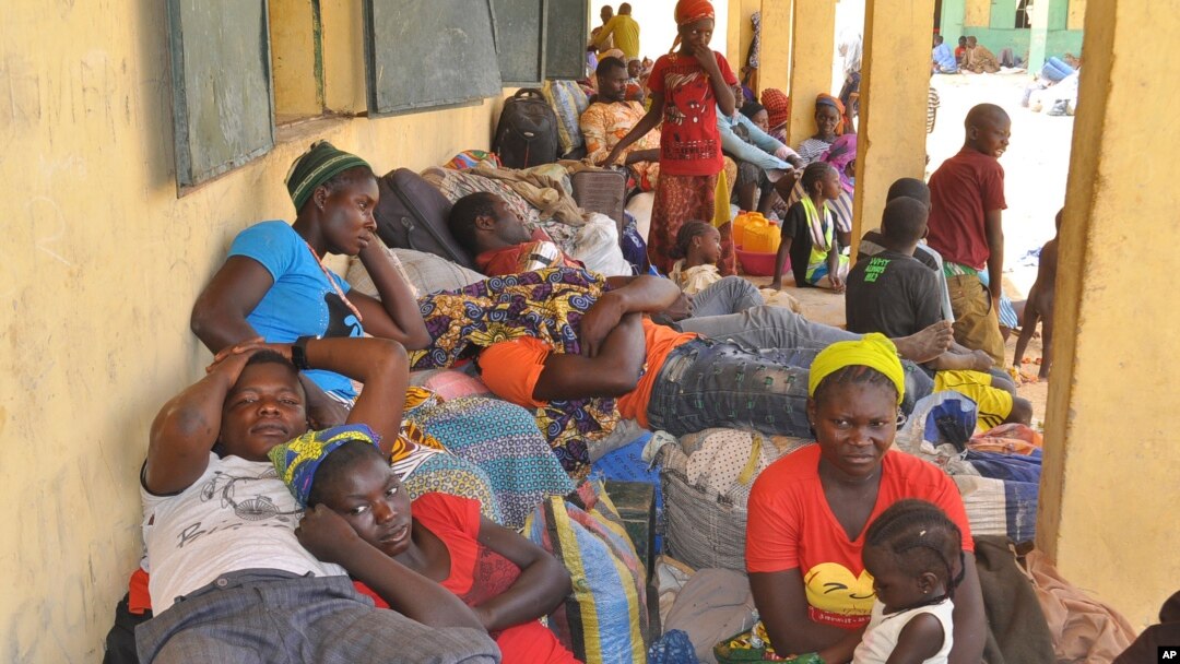 Nigeria refugees - deported by Niger troops - rest after they arrive in Gaidam, Nigeria, May 6, 2015. 