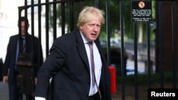 Britain's former Secretary of State for Foreign and Commonwealth Affairs Boris Johnson is criticized for saying women who wear burqas look like "letterboxes" and "bank robbers."