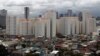 Rows of condominium buildings are seen behind a middle-class residential district in Mandaluyong, Metro Manila, July 4, 2012.