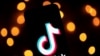 FILE - The logo of the social media video sharing app Tiktok is displayed on a tablet screen in Paris, Nov. 21, 2019.