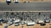 FILE - A human chain is formed in a vigil calling for maintaining a U.N. resolution authorizing the passage of humanitarian aid into Syria's rebel-held northwestern province of Idlib through the Bab al-Hawa border crossing with Turkey, July 2, 2021.