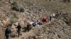 Afghan men lead donkeys loaded with ballot boxes and other election material to be transported to polling stations which are not accessible by road in Shutul, Panjshir province, Afghanistan, Sept. 27, 2019.