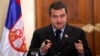 Serbia's Prime Minister Ivica Dacic gestures as speaks to the media during a press conference after meeting with Cyprus' president Dimitris Christofias, unseen, at presidential palace in divided capital Nicosia, Friday, Dec. 7, 2012. Dacic said talks for 