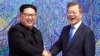 North Korean leader Kim Jong Un, left, poses with South Korean President Moon Jae-in for a photo inside the Peace House at the border village of Panmunjom in Demilitarized Zone, April 27, 2018. 