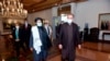 FILE - Pakistan's Foreign Minister Shah Mahmood Qureshi, right, and Mullah Abdul Ghani Baradar, head of a Taliban political team, arrive at the Foreign Ministry for talks, Islamabad, Dec. 16, 2020. (Photo provided by Pakistan's Ministry of F. Affairs) 
