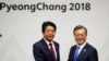 South Korean President Moon Jae-in shakes hands with Japanese Prime Minister Shinzo Abe during their meeting in Pyeongchang, South Korea, Feb. 9, 2018.
