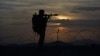 FILE - A Pakistani border security guard stands alert at Pakistan-Afghanistan border post, Chaman, May 5, 2017. 