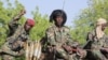 FILE - Chadian soldiers of the Joint Task Force fighting Boko Haram jihadists are seen on patrol in Monguno, Nigeria, Dec. 15, 2019.