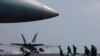 A U.S. Navy F-18 fighter jet takes off from the deck of the USS Carl Vinson (CVN 70) aircraft carrier following a routine patrol off the disputed South China Sea, March 3, 2017. 