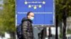 A man wears a face mask as the spread of coronavirus disease (COVID-19) continues in Milan, Italy, April 3, 2020. 
