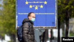A man wears a face mask as the spread of coronavirus disease (COVID-19) continues in Milan, Italy, April 3, 2020. 