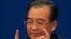 Chinese Premier Wen Jiabao gestures as he answers questions during a press conference after the closing session of the annual National People's Congress in Beijing's Great Hall of the People, China, Monday, March 14, 2011. (AP Photo/Ng Han Guan)