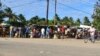 FILE - Residents visit a market in Macomia, northern Mozambique, June 11, 2018. Some experts believe IS set its sights on Mozambique, particularly its northern region, because of the economic disparity that can drive radical Islamist ideology.