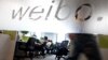 Employees work at their desks at a Sina Weibo office in Beijing's leading microblog site, (File photo).