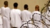 Detainees stand during an early morning Islamic prayer at the U.S. military prison in Guantanamo Bay, Cuba (2009 file photo)