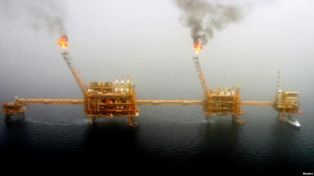 FILE - Gas flares from an oil production platform at the Soroush oil fields in the Persian Gulf, south of Tehran.