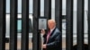 U.S. President Donald Trump prepares to autograph a plaque commemorating the construction of the 200th mile of border wall while visiting the wall on the U.S.-Mexico border in San Luis, Arizona, June 23, 2020.
