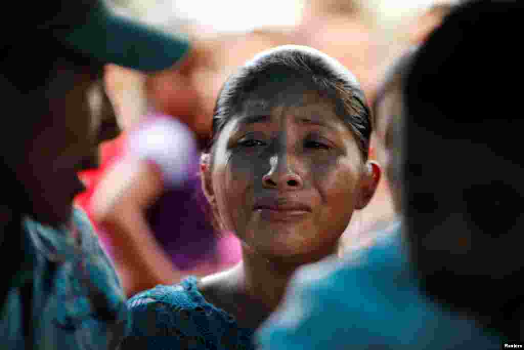 Claudia Maquin, mother of Jakelin Caal, a 7-year-old girl who handed herself in to U.S. border agents earlier this month and died after developing a high fever while in the custody of U.S. Customs and Border Protection, reacts during her daughter's funeral at her home village of San Antonio Secortez, in Guatemala, Dec. 25, 2018.