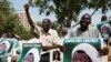 FILE - Protesters hold banners calling for the release of Sheikh Ibrahim El-Zakzaky, the leader of the Islamic Movement of Nigeria, in Abuja, Nigeria, Jan. 26, 2018.