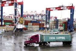 FILE - Containers are seen at the port in San Pedro, California, March 22, 2018.