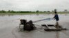 A Thai farmer plows his rice field in Ayutthaya province, central Thailand, June 21, 2013. 