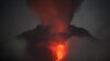 Mount Sinabung spews lava and gas during its eruption as seen from Jeraya, North Sumatra, Indonesia, early Jan. 20, 2014. 