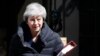 FILE - Britain's Prime Minister Theresa May leaves 10 Downing Street for the House of Commons for her weekly Prime Minister's questions in London, May 1, 2019.