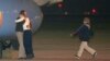Jeffrey Fowle is greeted by his son and other family members upon his arrival at Wright-Patterson Air Force Base, Ohio, Oct. 22, 2014.