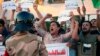 Iraqi protesters chant slogans demanding services and jobs during a demonstration in Tahrir Square, Baghdad, July 14, 2018.