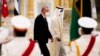 Turkish President Recep Tayyip Erdogan, left, and Abu Dhabi Crown Prince Sheikh Mohammed bin Zayed Al Nahyan look over an honor guard at Qasr Al-Watan in Abu Dhabi, United Arab Emirates, Feb. 14, 2022. 