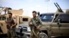 FILE - Fighters of Syrian Democratic Forces are seen in Deir el-Zour, Syria May 1, 2018.