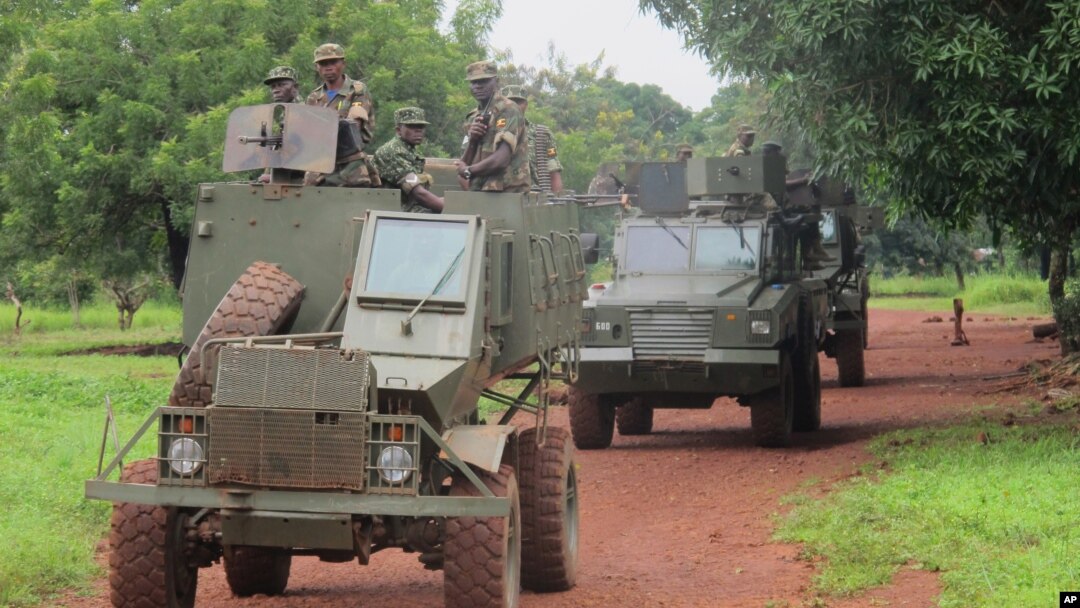 FILE - Ugandan troops patrol Zemio, in Central African Republic, where they are hunting down the fugitive members of the Lord's Resistance Army rebel group. 