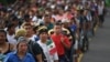 Honduran migrants take part in a caravan heading to the US on the road linking Ciudad Hidalgo and Tapachula, Chiapas state, Mexico, Oct. 21, 2018.