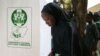 FILE - A woman casts her ballot during Nigeria's presidential election at a polling station in Kazaure, Jigawa state, Nigeria, Feb. 23, 2019. Nigerian election officials say they have recorded at least 42 attacks on its facilities since the 2019 polls. 