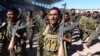 Syrian Democratic Forces celebrate the first anniversary of the Raqqa province liberation from the Islamic State group in Raqqa, Syria, Oct. 27, 2018.