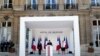 French President Emmanuel Macron speaks flanked by Defense Minister Florence Parly (L) and Junior Minister of Remembrance and Veterans Affairs Genevieve Darrieussecq (R) during an address to France's armed forces, July 13, 2020.