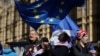 Anti-Brexit remain in the European Union supporters shout slogans during a protest outside the Houses of Parliament in London, March 14, 2019. 
