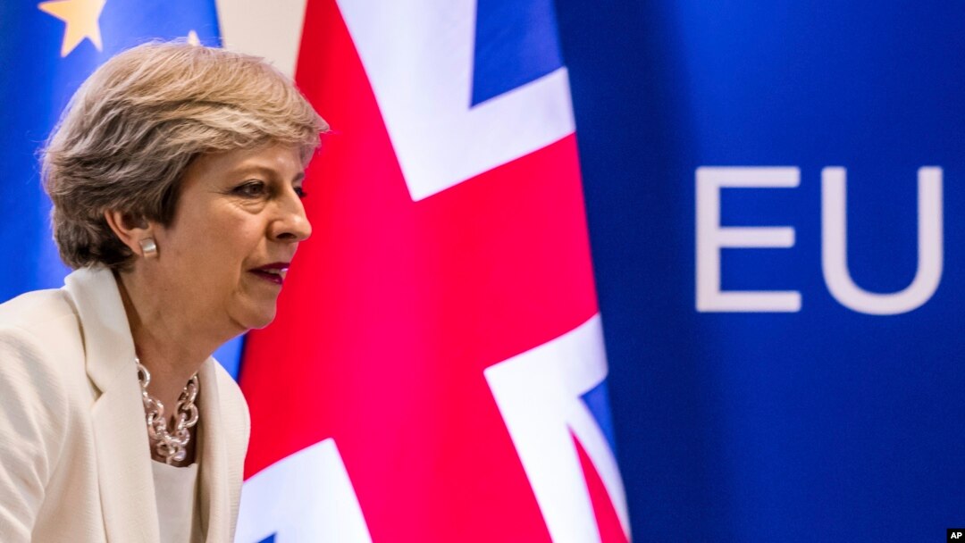 FILE - British Prime Minister Theresa May prepares to address a media conference at an EU summit in Brussels, June 23, 2017. More than six months have passed since Britain triggered the two-year countdown to its EU exit but separation talks are mired in details.