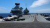 F-35B Lightning II aircraft are seen on the deck of the HMS Queen Elizabeth aircraft carrier offshore Portugal, May 27, 2021.
