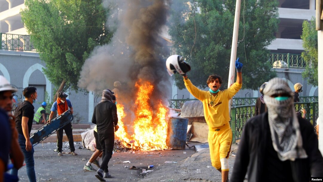 Iraqi demonstrators clash with security forces during anti-government protests in Baghdad, Nov. 9, 2019.
